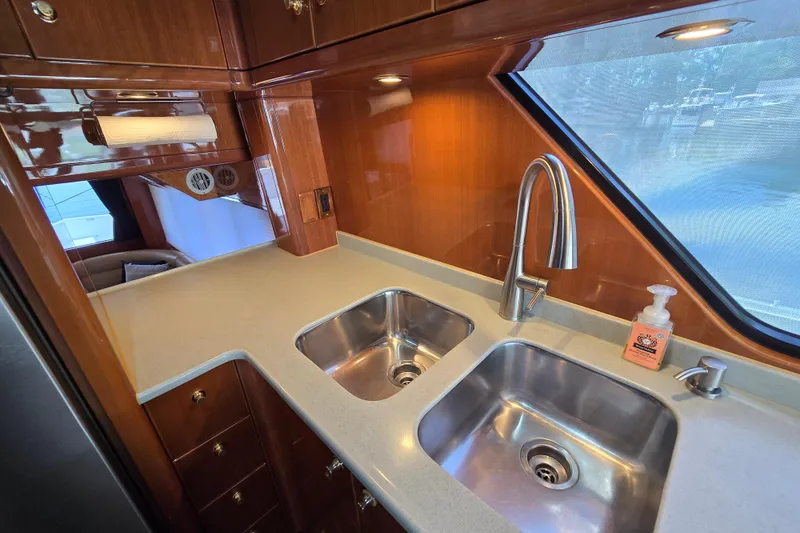 Slide: The Image of Luxurious kitchen area in a 2004 Grand Harbour 58 yacht with dual sinks. - 38