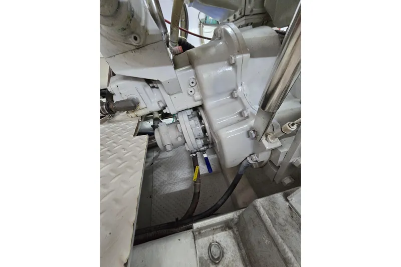 Slide: The Image of Engine compartment of a 2004 Grand Harbour 58 yacht, showcasing mechanical components. - 118