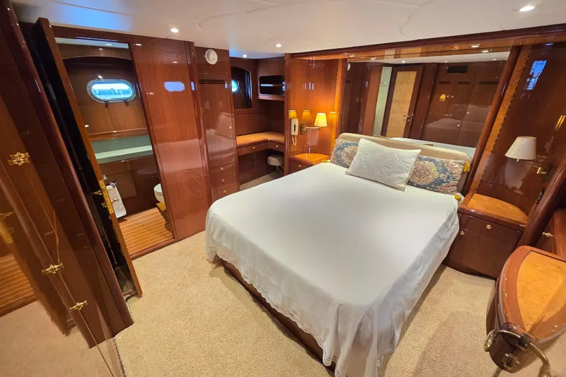 Slide: The Image of Luxurious bedroom interior of 2004 Grand Harbour 58 yacht with elegant wood finishes. - 42