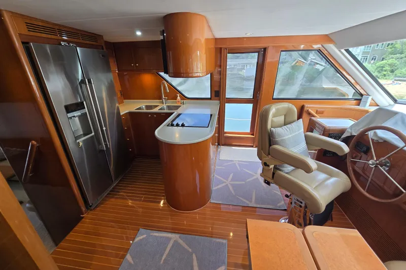 Slide: The Image of Luxurious 2004 Grand Harbour 58 yacht interior with modern kitchen and captain's chair. - 34
