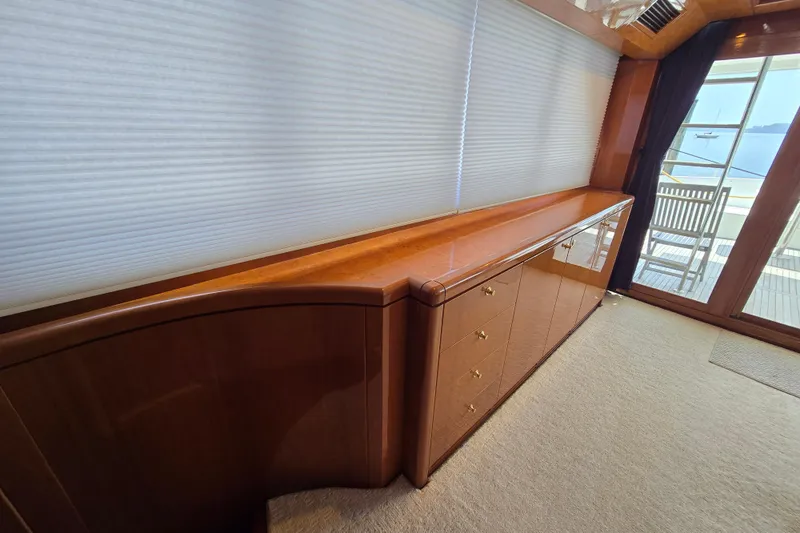 Slide: The Image of Luxurious interior of 2004 Grand Harbour 58 yacht with wooden cabinetry and large windows. - 15