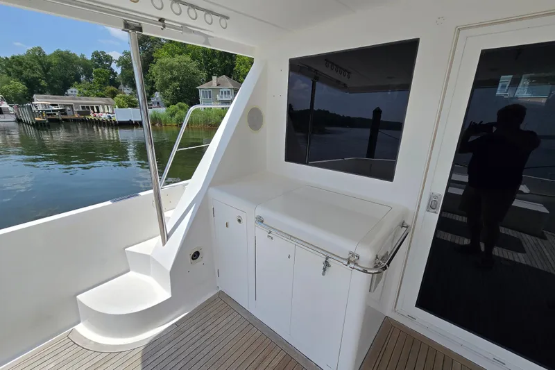 Slide: The Image of Outdoor deck of 2004 Grand Harbour 58 yacht with scenic waterfront view. - 9