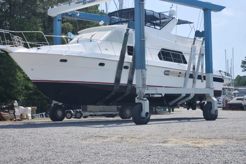 Slide: The Image of Grand Harbour 58 yacht from 2004 in a boatyard lift, ready for maintenance. - 137