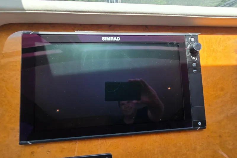 Slide: The Image of Simrad marine display on 2004 Grand Harbour 58 yacht dashboard. - 25