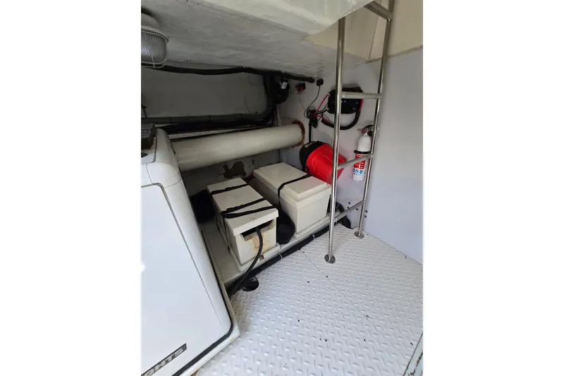 Slide: The Image of Engine room of 2004 Grand Harbour 58 yacht with equipment and safety features. - 111