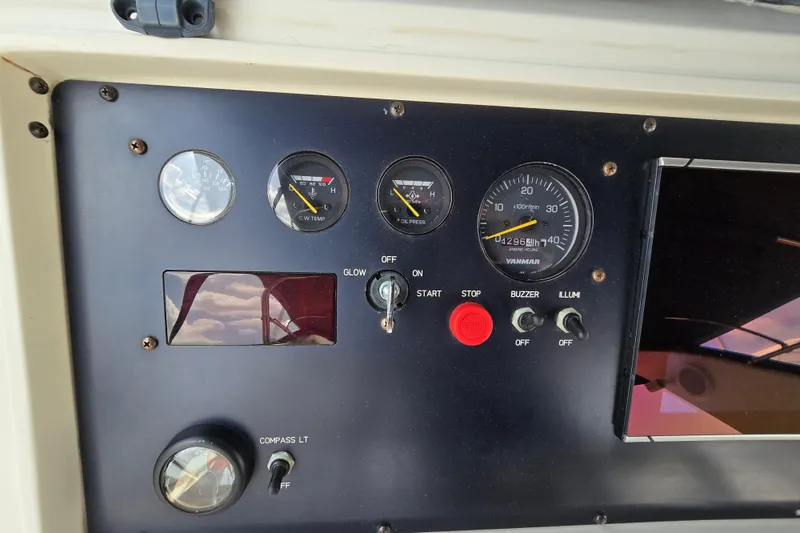 Slide: The Image of Control panel of a 2004 Grand Harbour 58 yacht with gauges and switches. - 93