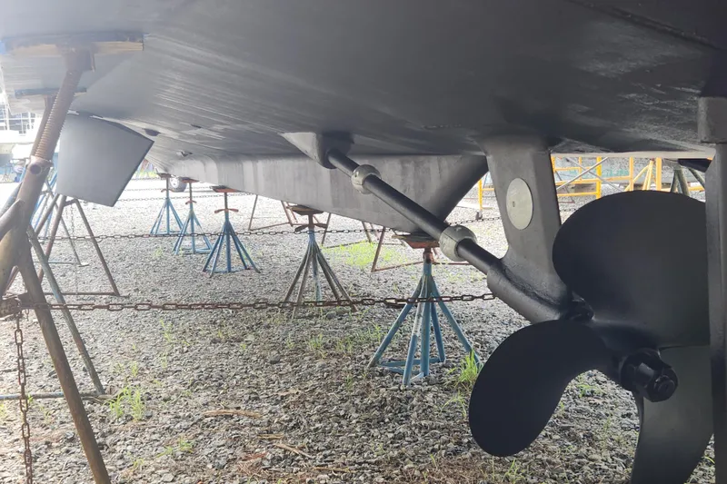 Slide: The Image of Underneath view of a 2004 Grand Harbour 58 yacht on stands, showing propeller and hull. - 135