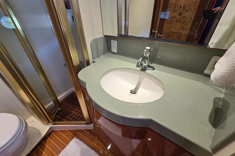 Slide: The Image of Luxurious bathroom in 2004 Grand Harbour 58 yacht with modern sink and shower. - 72