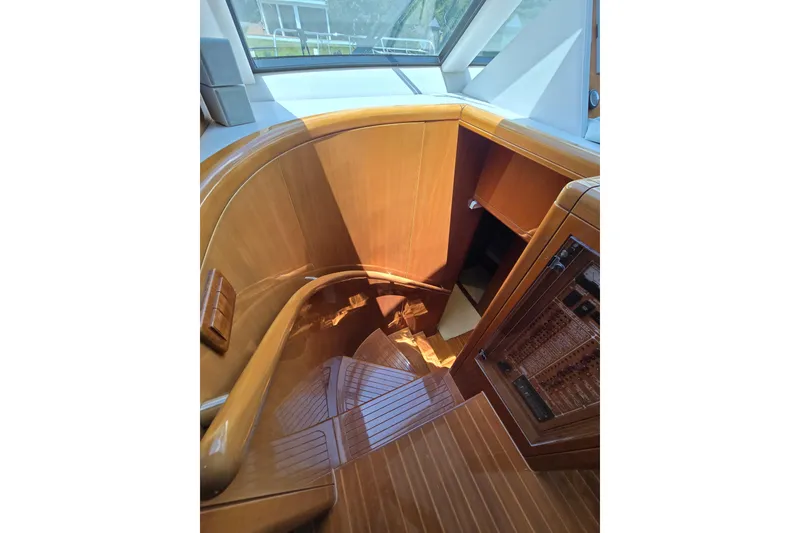 Slide: The Image of Luxurious wooden staircase inside 2004 Grand Harbour 58 yacht, showcasing elegant craftsmanship. - 60