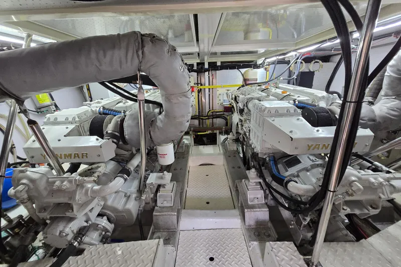 Slide: The Image of Engine room of a 2004 Grand Harbour 58 yacht featuring Yanmar engines. - 116
