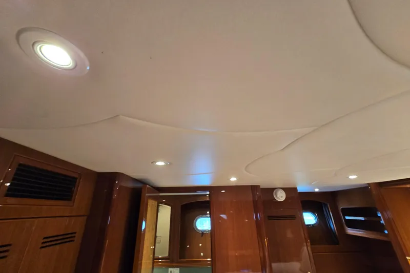 Slide: The Image of Interior of 2004 Grand Harbour 58 yacht with wooden paneling and recessed lighting. - 48