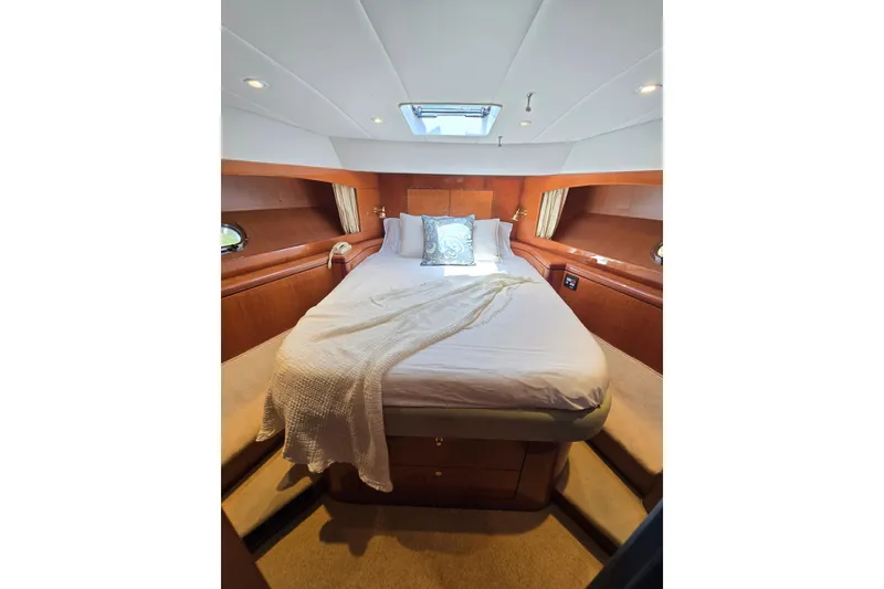 Slide: The Image of Luxurious bedroom interior of 2004 Grand Harbour 58 yacht with cozy bedding and elegant wood finish. - 66