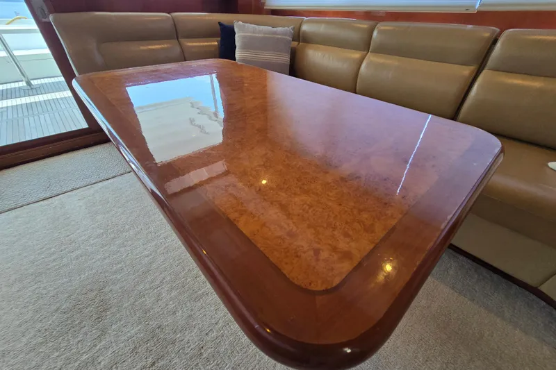 Slide: The Image of Luxurious wooden table in a 2004 Grand Harbour 58 yacht interior. - 14