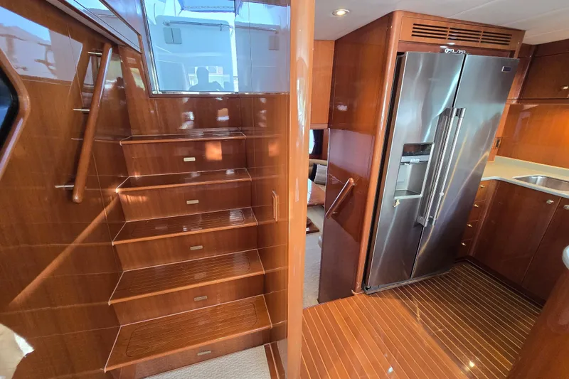 Slide: The Image of Luxurious 2004 Grand Harbour 58 yacht interior with wooden stairs and modern kitchen. - 35