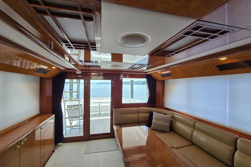 Slide: The Image of Luxurious interior of 2004 Grand Harbour 58 yacht with elegant wood finishes and comfortable seating. - 12