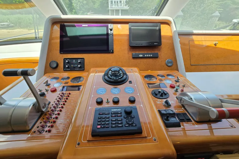 Slide: The Image of Control panel of a 2004 Grand Harbour 58 yacht with navigation instruments and controls. - 24
