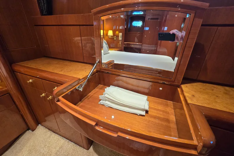 Slide: The Image of Luxurious wooden vanity with mirror in 2004 Grand Harbour 58 yacht interior. - 46