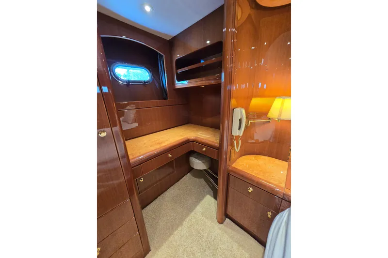 Slide: The Image of Luxurious wooden interior of a 2004 Grand Harbour 58 yacht with elegant cabinetry and lighting. - 45