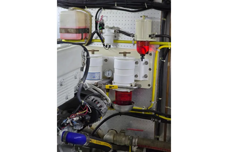 Slide: The Image of Engine room of 2004 Grand Harbour 58 yacht with fuel filters and wiring. - 122