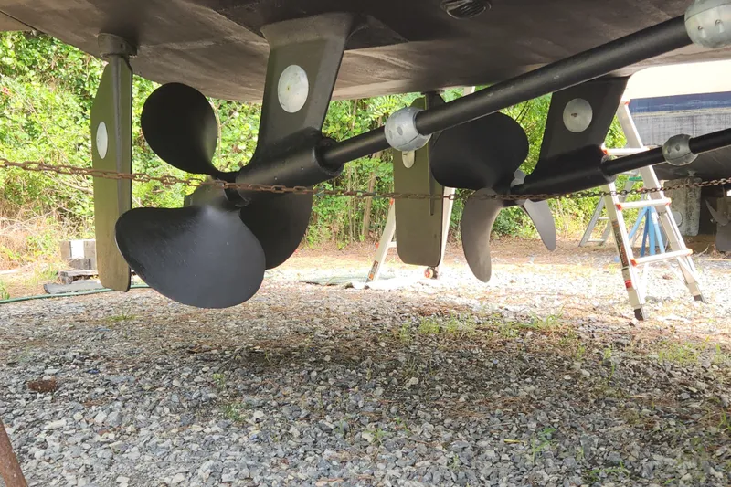 Slide: The Image of Underwater view of 2004 Grand Harbour 58 yacht propellers and rudders on gravel. - 136