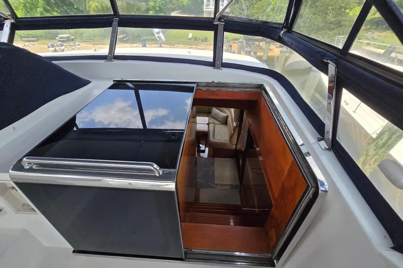 Slide: The Image of Interior view of 2004 Grand Harbour 58 yacht, featuring luxurious seating and sleek design. - 97