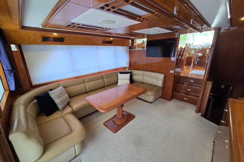 Slide: The Image of Luxurious 2004 Grand Harbour 58 yacht interior with plush seating and elegant wood finishes. - 10