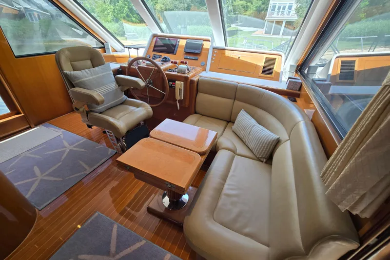 Slide: The Image of Luxurious 2004 Grand Harbour 58 yacht interior with leather seating and modern helm station. - 23