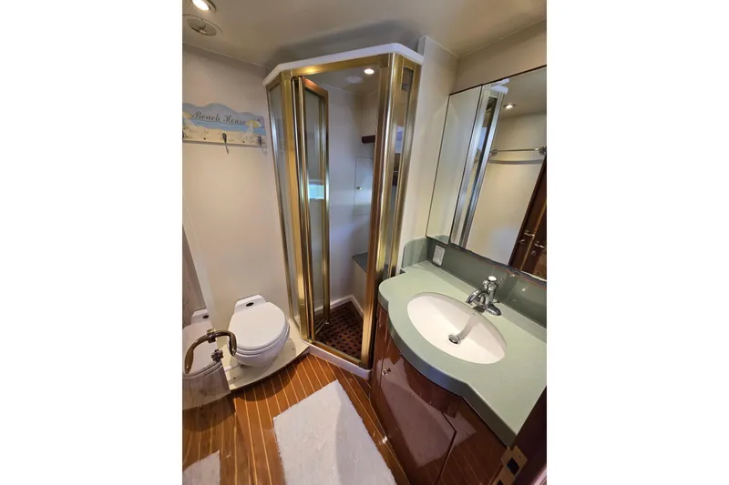 Slide: The Image of Luxurious 2004 Grand Harbour 58 yacht bathroom with modern fixtures and elegant design. - 71