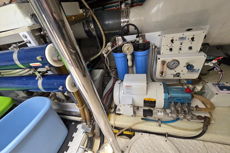 Slide: The Image of Engine room of 2004 Grand Harbour 58 yacht with water filtration system and gauges. - 106