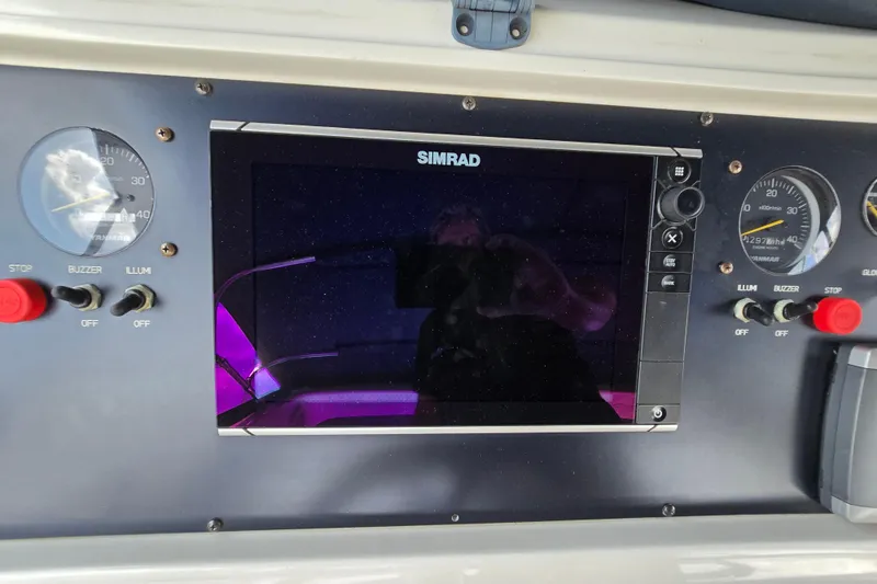 Slide: The Image of Control panel of a 2004 Grand Harbour 58 yacht with Simrad display and gauges. - 91