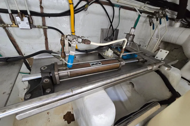 Slide: The Image of Hydraulic system in a 2004 Grand Harbour 58 yacht engine room, featuring pipes and valves. - 114