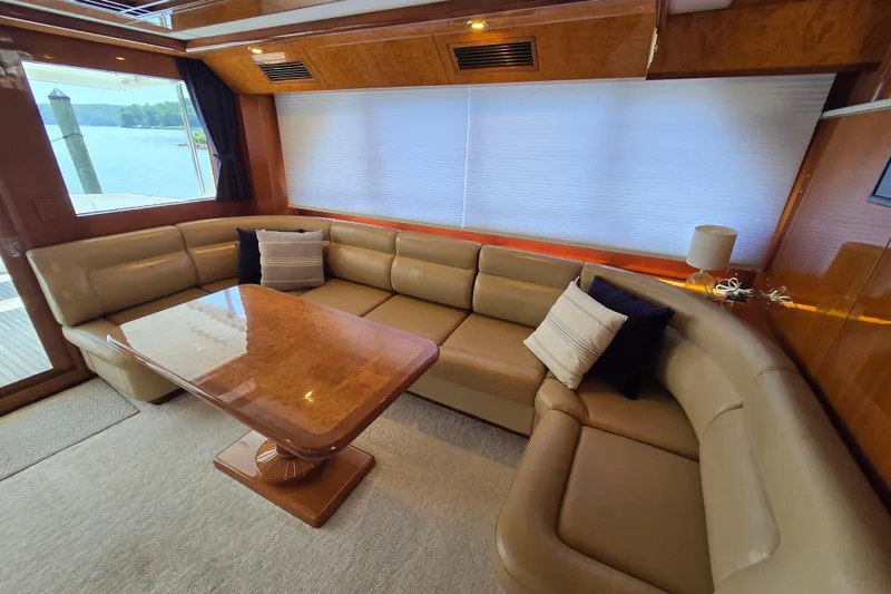 Slide: The Image of Luxurious interior of 2004 Grand Harbour 58 yacht with leather seating and wooden table. - 13
