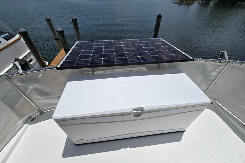 Slide: The Image of Solar panel and storage box on 2004 Grand Harbour 58 yacht deck by the water. - 86