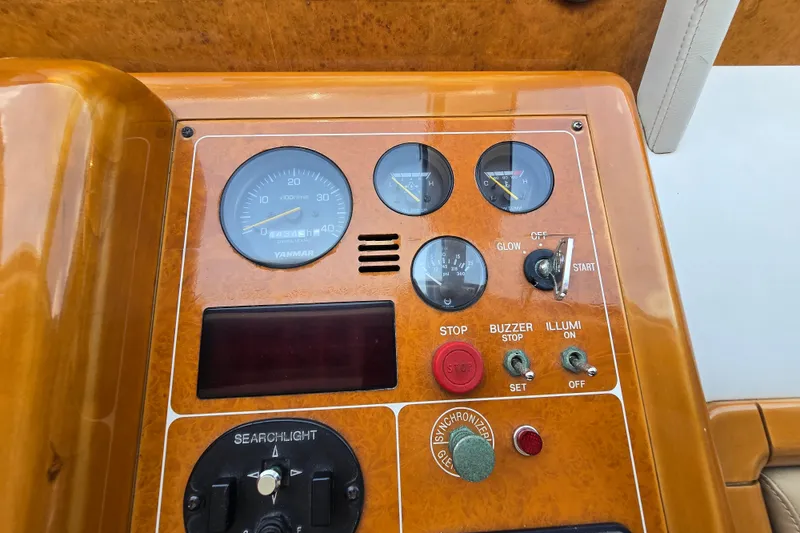 Slide: The Image of Control panel of a 2004 Grand Harbour 58 yacht with gauges and switches. - 28