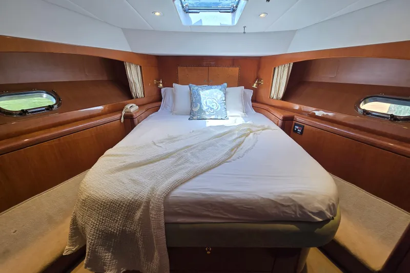 Slide: The Image of Luxurious cabin interior of 2004 Grand Harbour 58 yacht with cozy bed and elegant decor. - 67
