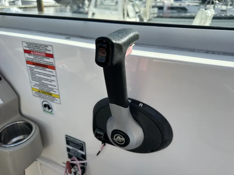 Slide: The Image of Close-up of a throttle lever on a Sea Ray Sundancer 260 boat. - 43