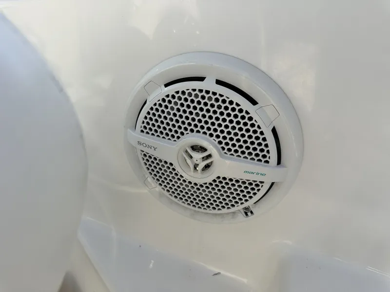 Slide: The Image of A Sony marine speaker is mounted on the white surface of a boat. - 36