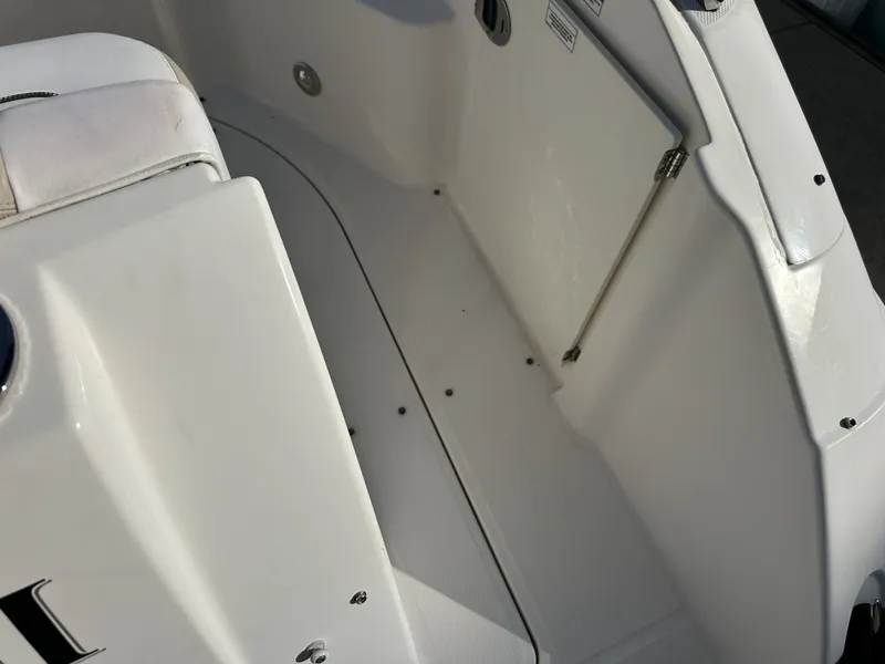 Slide: The Image of Close-up of the cockpit area of a 2010 Sea Ray Sundancer 260 with white surfaces. - 24