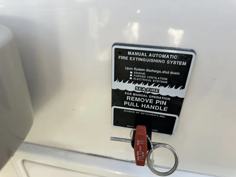Slide: The Image of A fire extinguishing system with a red "FIRE" key on a boat. - 44