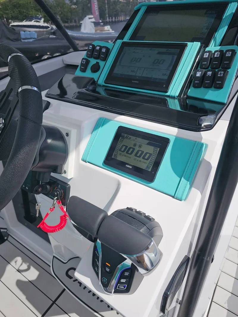 Slide: The Image of Control panel of 2025 Ranieri CAYMAN 27.0 SPORT TOURING boat with modern navigation system. - 16
