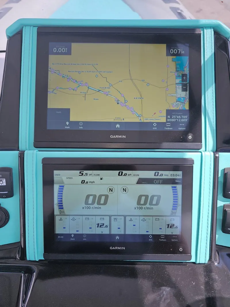 Slide: The Image of Garmin navigation and control screens on a 2025 Ranieri CAYMAN 27.0 SPORT TOURING boat. - 15
