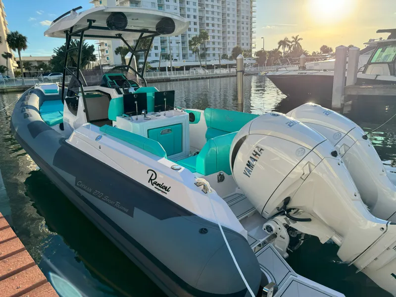 Slide: The Image of 2025 Ranieri CAYMAN 27.0 SPORT TOURING boat docked at marina, sunset view. - 29