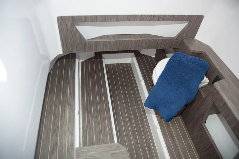 Slide: The Image of Interior of 2025 Ranieri CAYMAN 27.0 SPORT TOURING with modern wood flooring. - 20