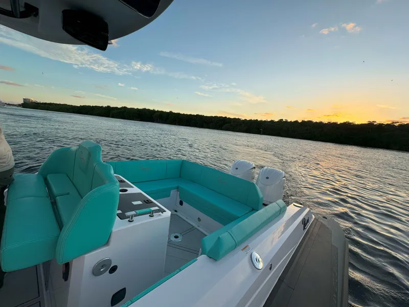 Slide: The Image of 2025 Ranieri CAYMAN 27.0 SPORT TOURING boat on water at sunset. - 26