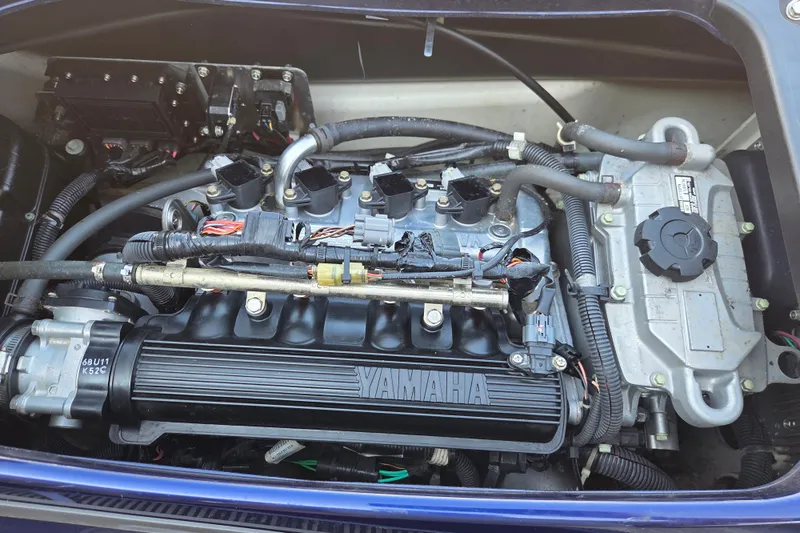 Slide: The Image of Engine of a 2015 Yamaha WaveRunner VX Cruiser, showcasing intricate components and wiring. - 6