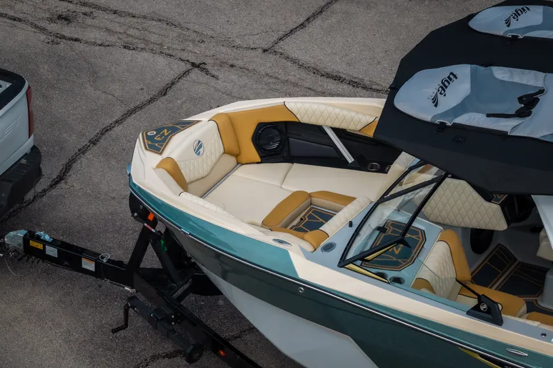 Slide: The Image of 2026 Tigé Z3 boat with luxurious interior, hitched to a vehicle, ready for transport. - 9