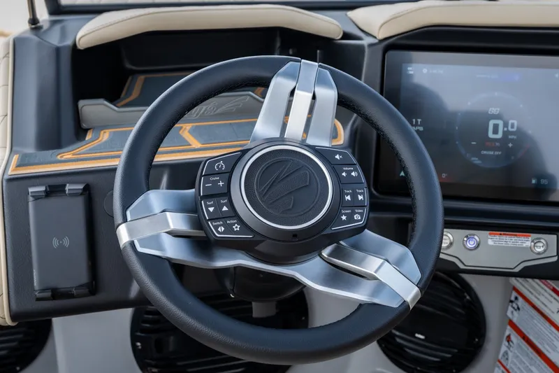 Slide: The Image of Steering wheel and dashboard of 2026 Tigé Z3 boat with modern controls and touchscreen display. - 36