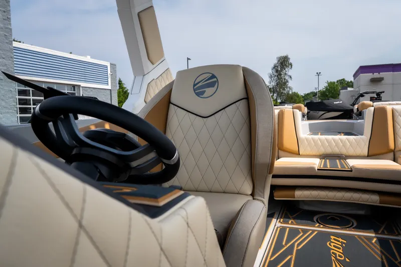 Slide: The Image of Luxurious interior of 2026 Tigé Z3 boat with elegant seating and modern steering wheel. - 45