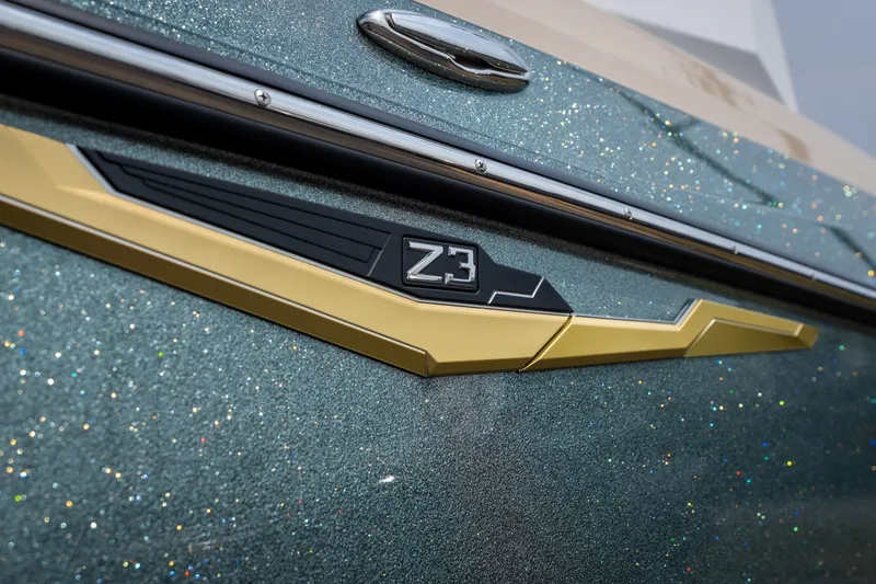 Slide: The Image of 2026 Tigé Z3 boat emblem on a sparkling metallic surface. - 5