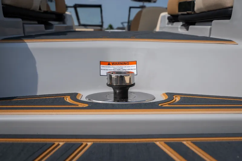 Slide: The Image of 2026 Tigé Z3 boat deck with warning label and cleat detail. - 24